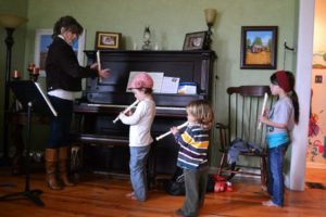 Family practicing the recorder together