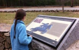 Child looking at educational placard