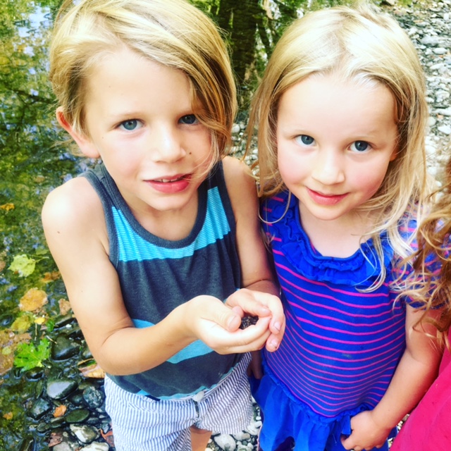 young siblings with nature discovery