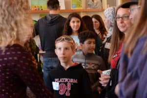 Boy student attending Oak meadow Annual fall open house in brattleboro vermont