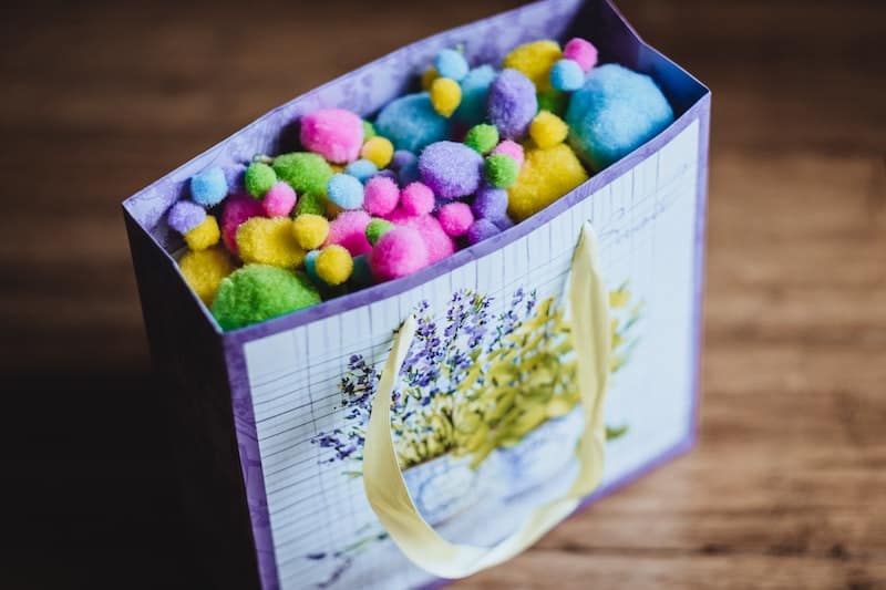 Bag filled with multicolor felted wool balls