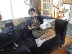 Ben Parker Reading the Newspaper on the Couch