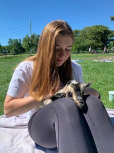 Diana Wipf holding a baby goat