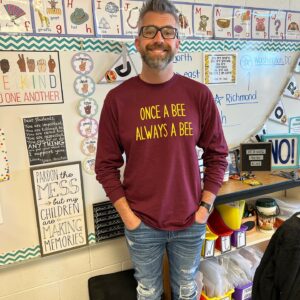 Justin Neal, Oak Meadow teacher, standing in a classroom