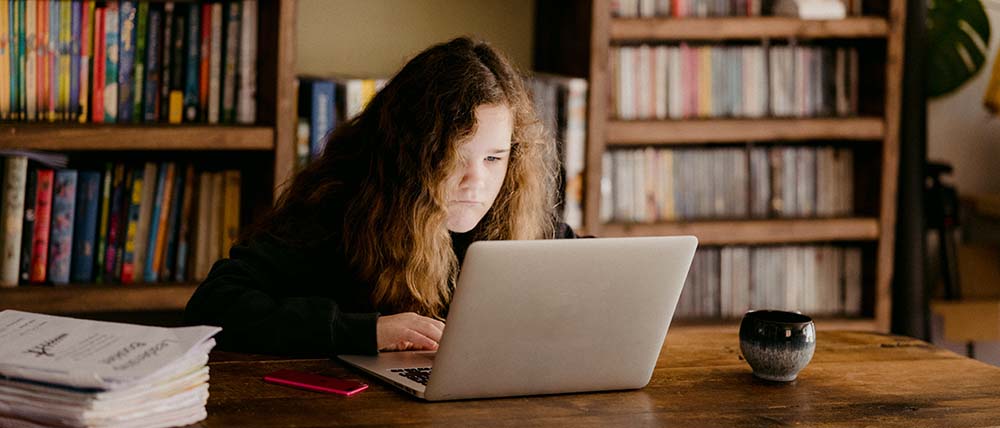 student looking at laptop