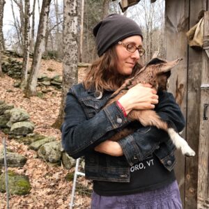 Educational Counselor Shannon Herrick holding a baby goat