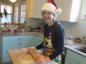 Neesa Kienitz Peak baking in a santa hat