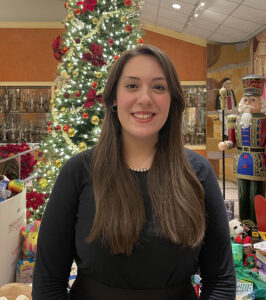 Zoe Meredith headshot in front of holiday decorations