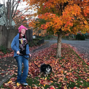 saydi grey in the fall with her dog